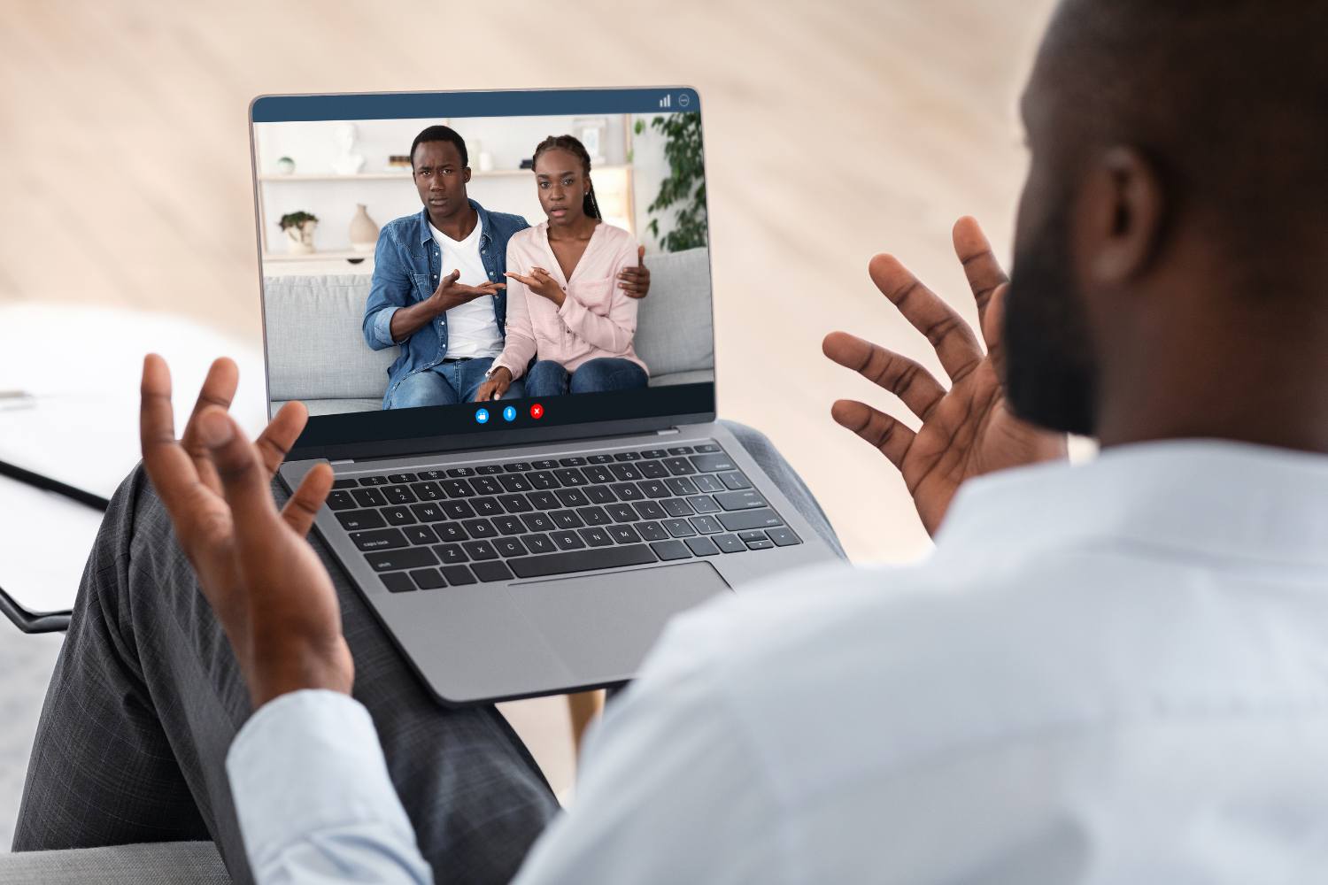 Black Couple sharing with a psychologist during online therapy - teletherapy